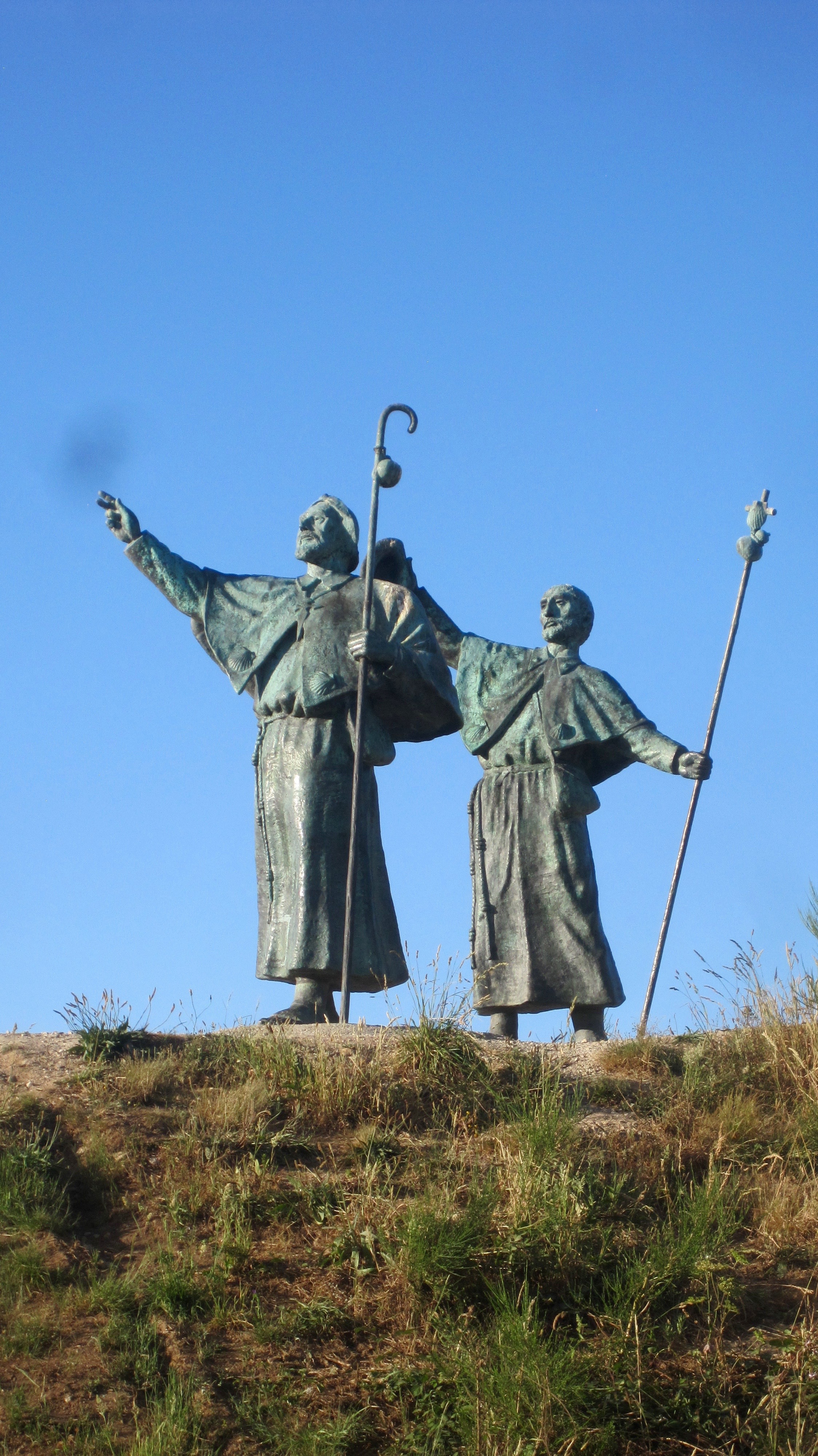 Statues of pilgrims greeting Santiago