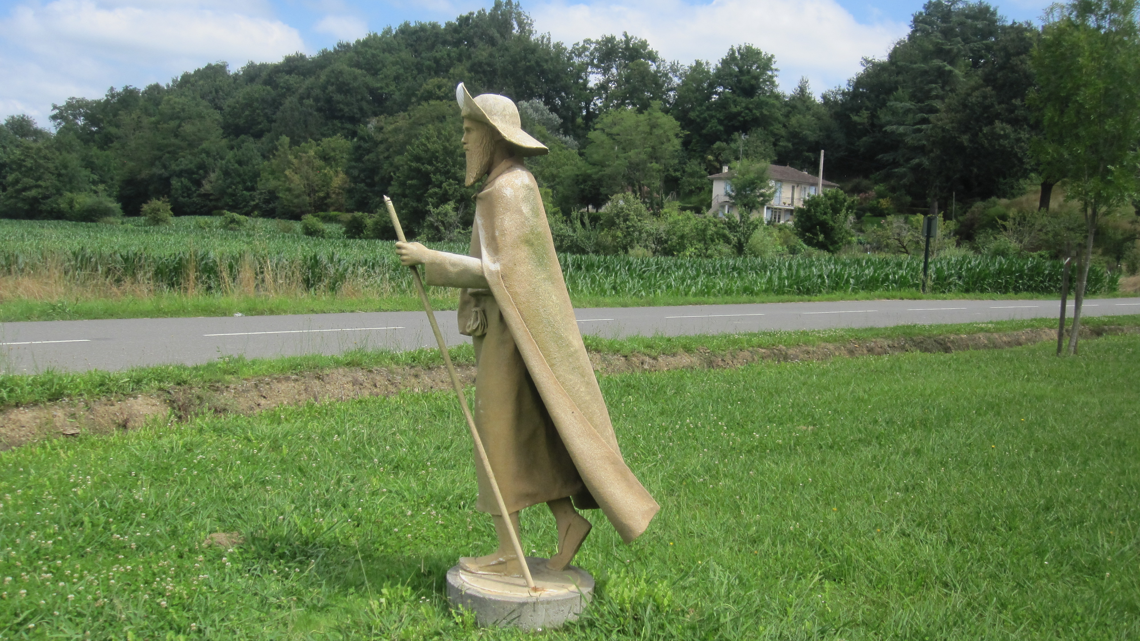 Statue of a pilgrim with staff, shell and the typical pilgrim’s hat